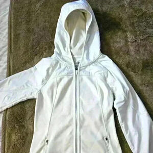 The North Face womens Ivory/cream color. Size XS.